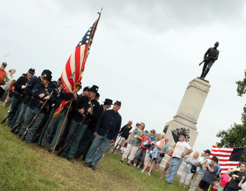 Fourteen members of the 1st Minnesota Volunteer Infantry reenactment organization lead the participants from the regimental monument to Plum Run, the site of the famed charge, during the July 2, 2013 ceremony.