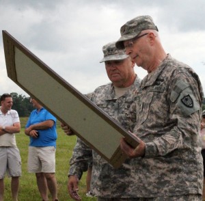 Major General  Rick Nash (right), Minnesota Adjutant General, presents a framed portrait of the 1st Minnesota charge to Major General Perry Smith, Alabama Adjutant General, during the July 2, 2013 ceremony in Gettysburg, Pa.