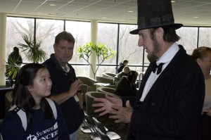 Max Daniels, portraying President Abraham Lincoln, discusses the Gettysburg Address with a Century College student in White Bear Lake, Minn. on Nov. 19, the 150th Anniversary of Lincoln's historic speech. The event was sponsored by the Minnesota Civil War Commemoration Task Force. (Photo by Jeffrey Williams/Minnesota Civil War Commemoration Task Force)